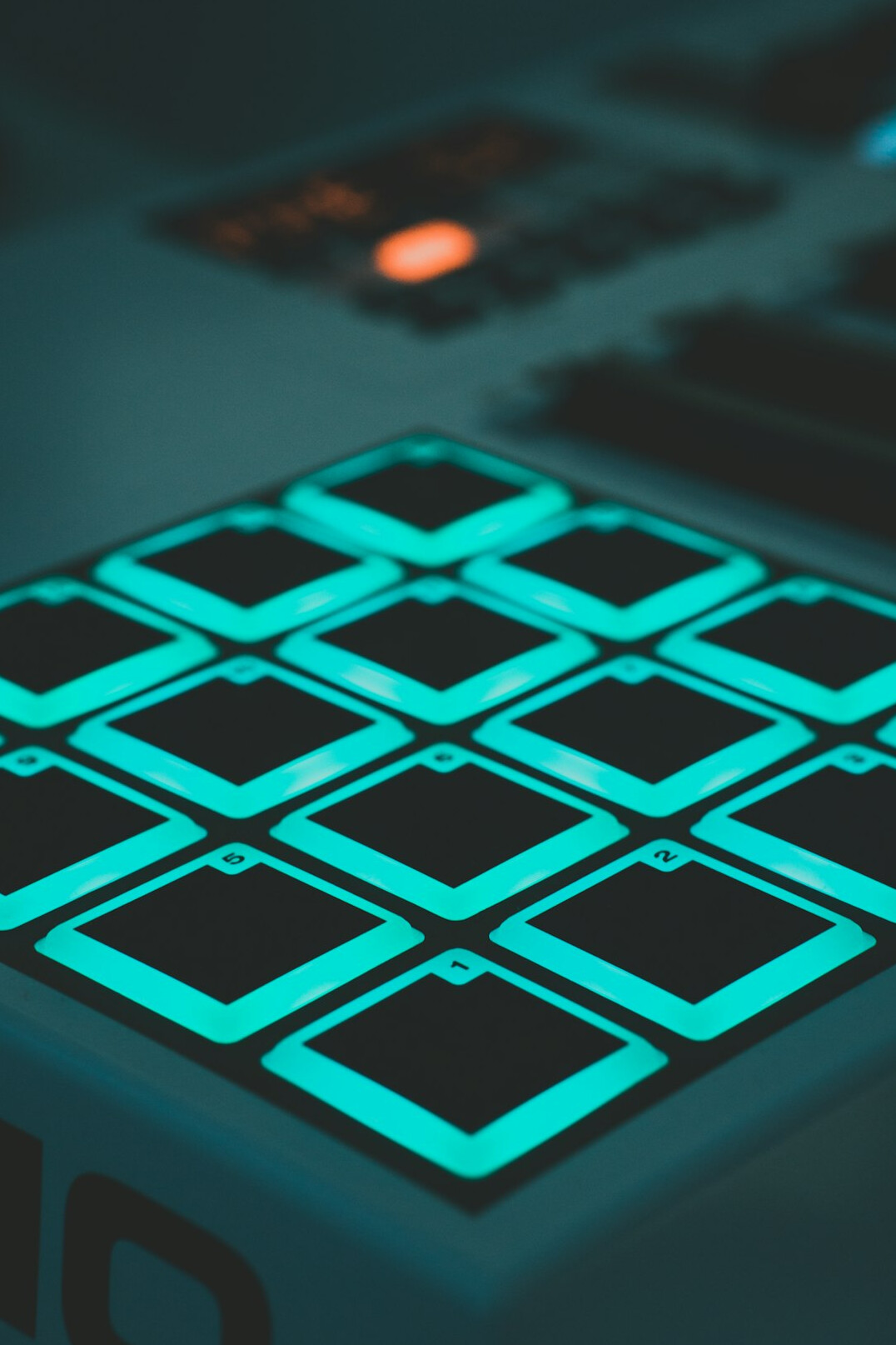 Close up of a video switcher panel with glowing buttons