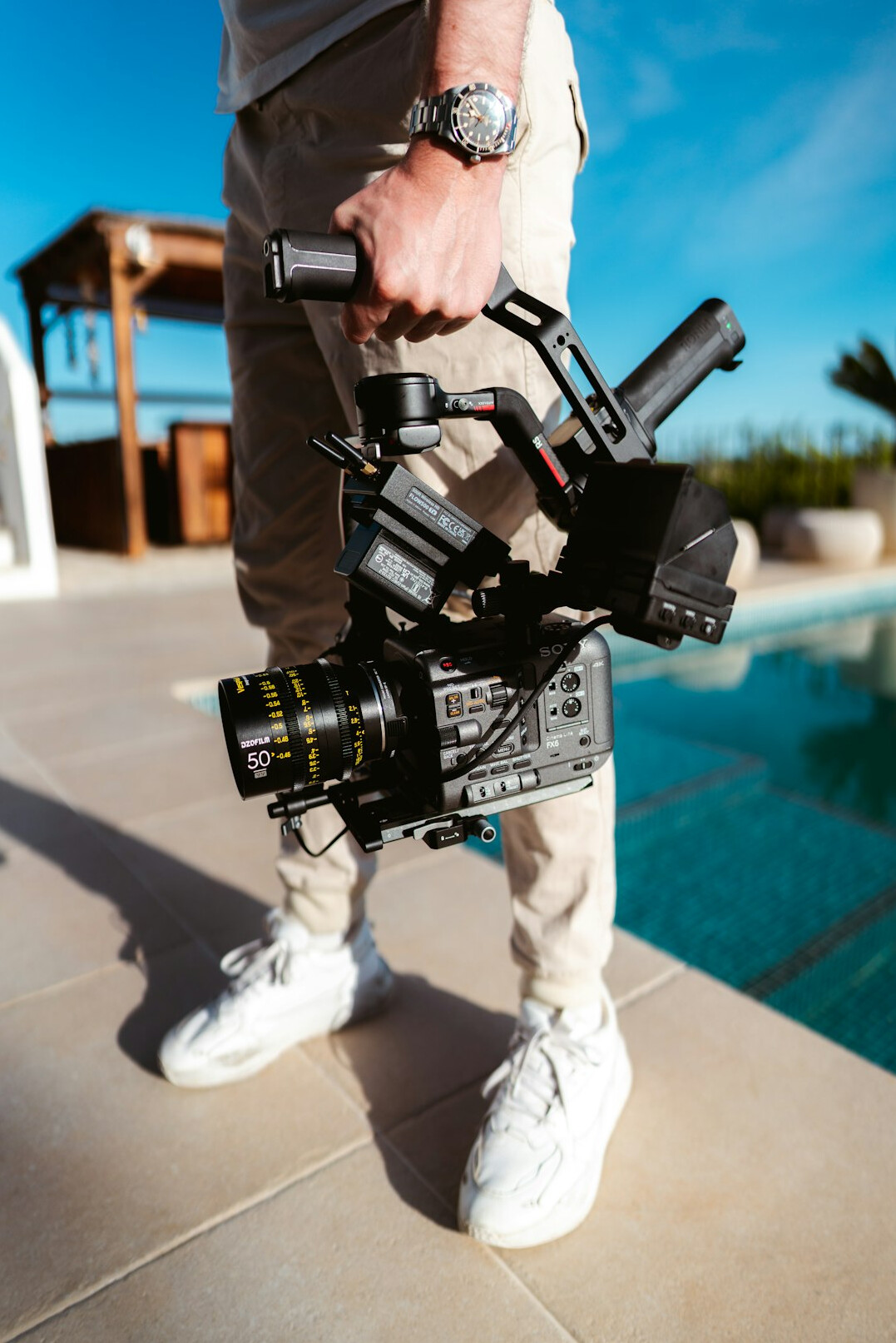 Camera operator holding a professional broadcast camera